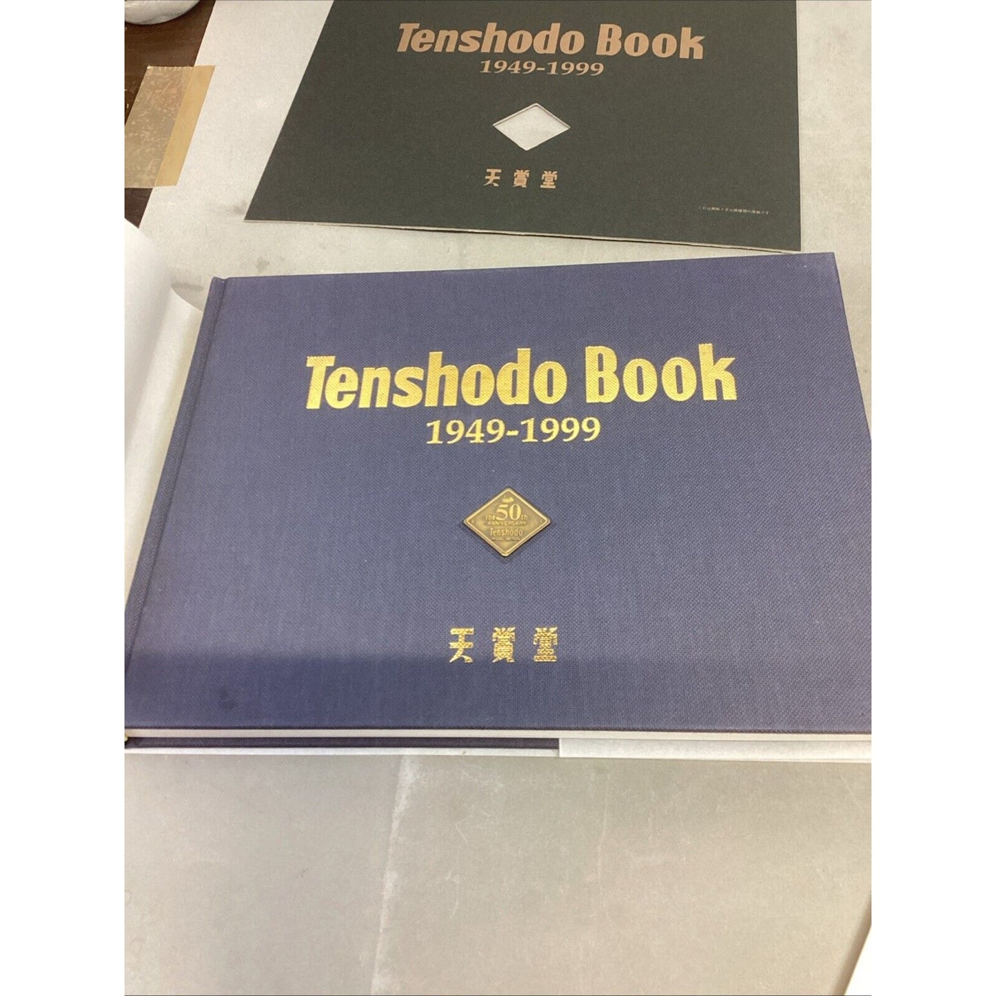 Tenshodo Book 1949-1999 Hardback in Plastic Case w/ 2 Inserts - English/Chinese