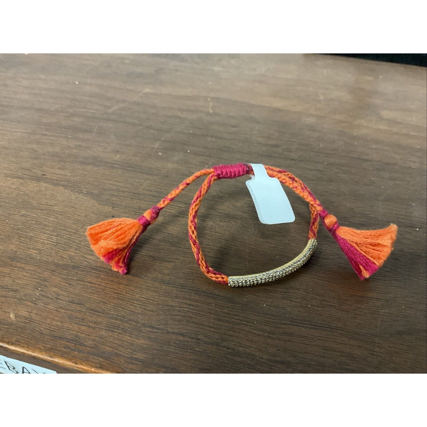 Orange And Pink Tassel Bracelet With Gold Band