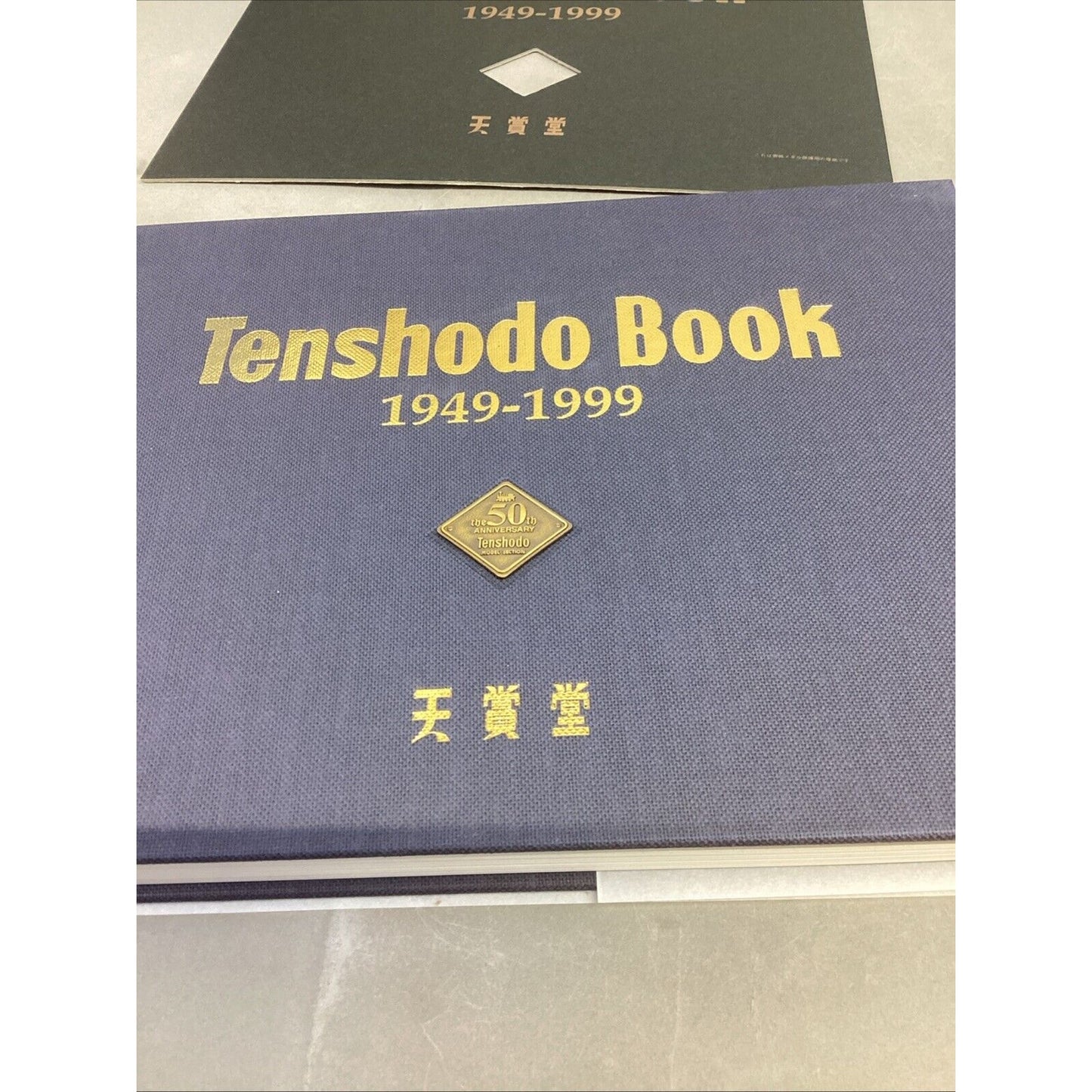 Tenshodo Book 1949-1999 Hardback in Plastic Case w/ 2 Inserts - English/Chinese