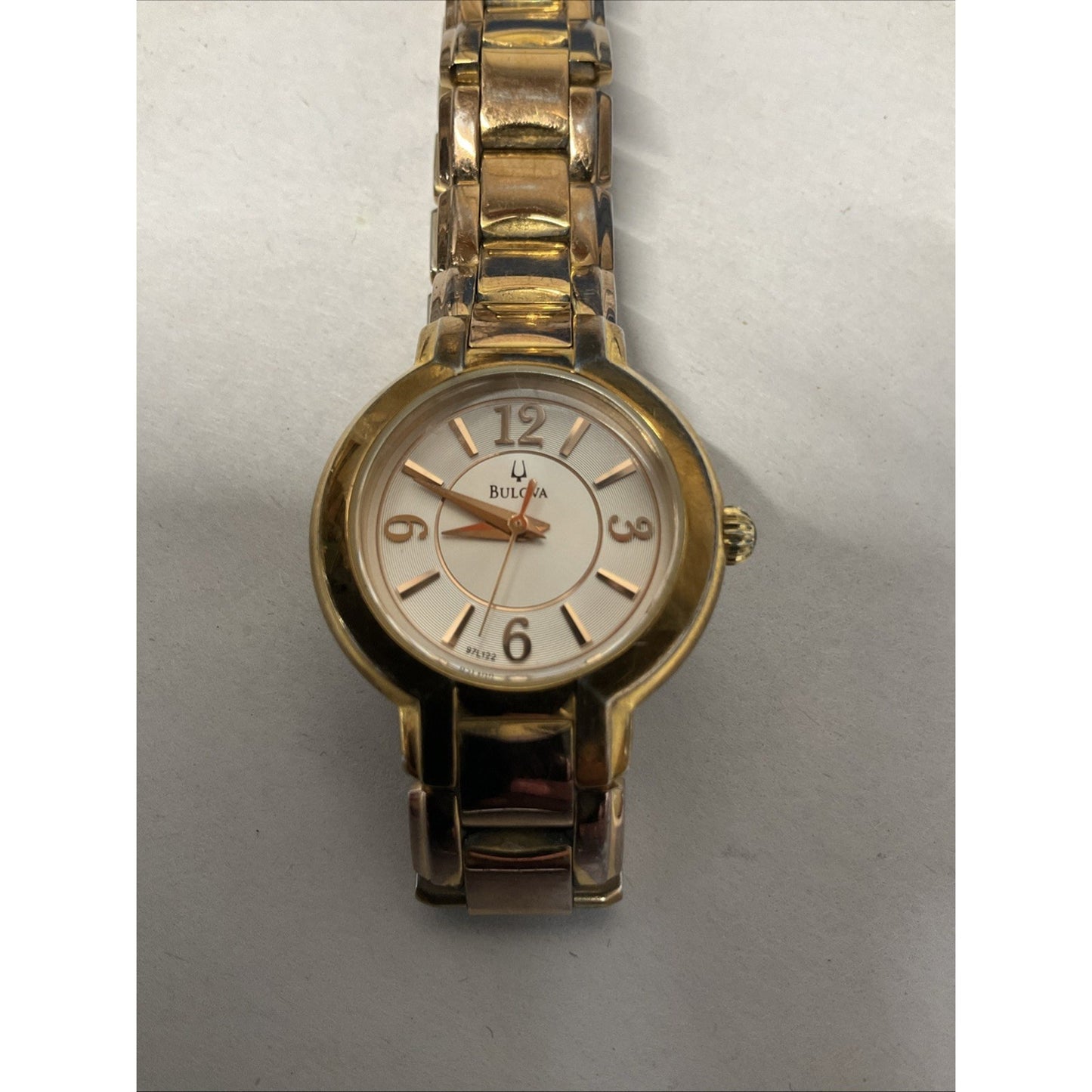 Bulova gold tone watch with silver face