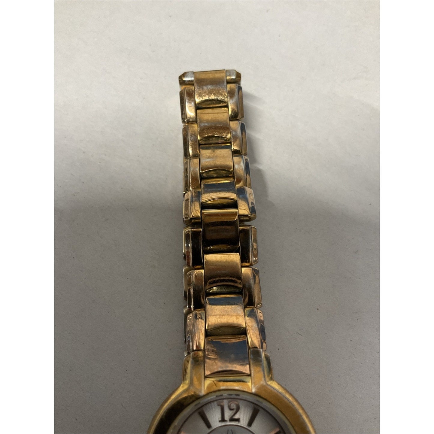 Bulova gold tone watch with silver face