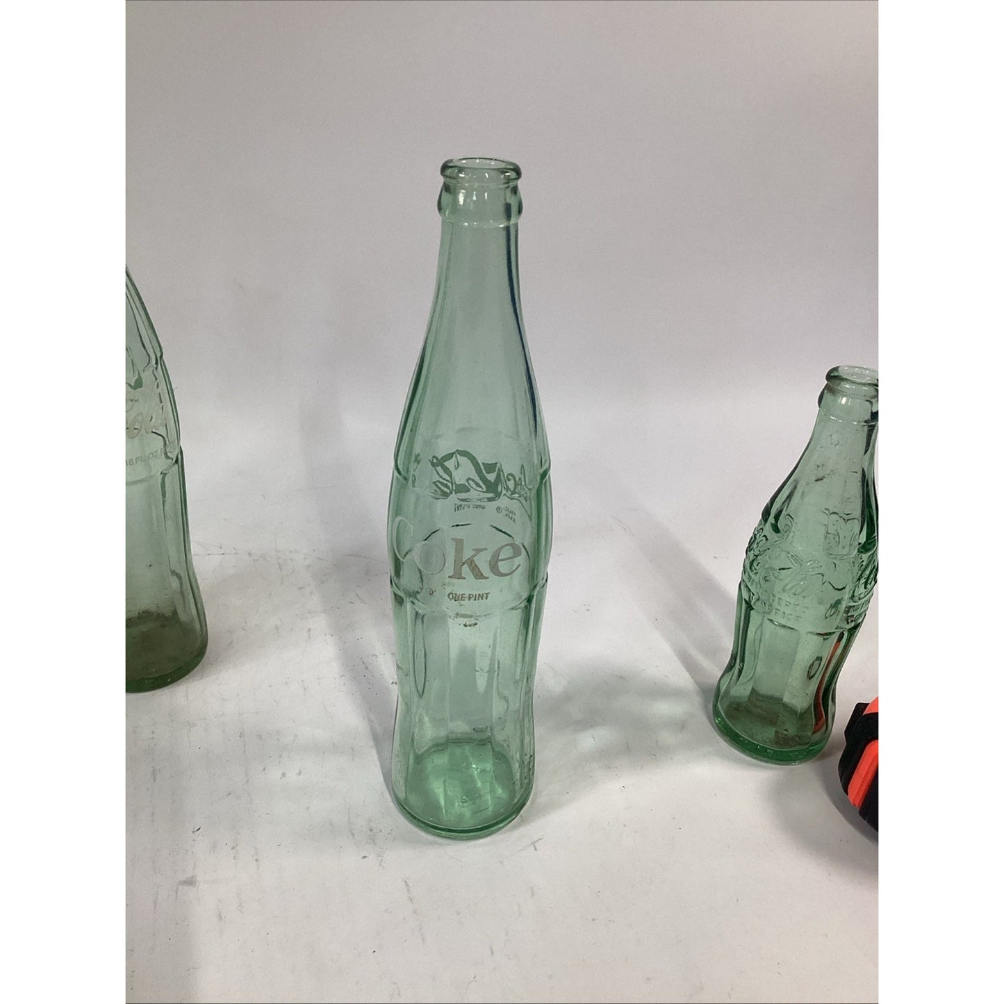 Lot of 7 Vintage Green Glass 16 Oz 1 Pint Coca Cola Bottles