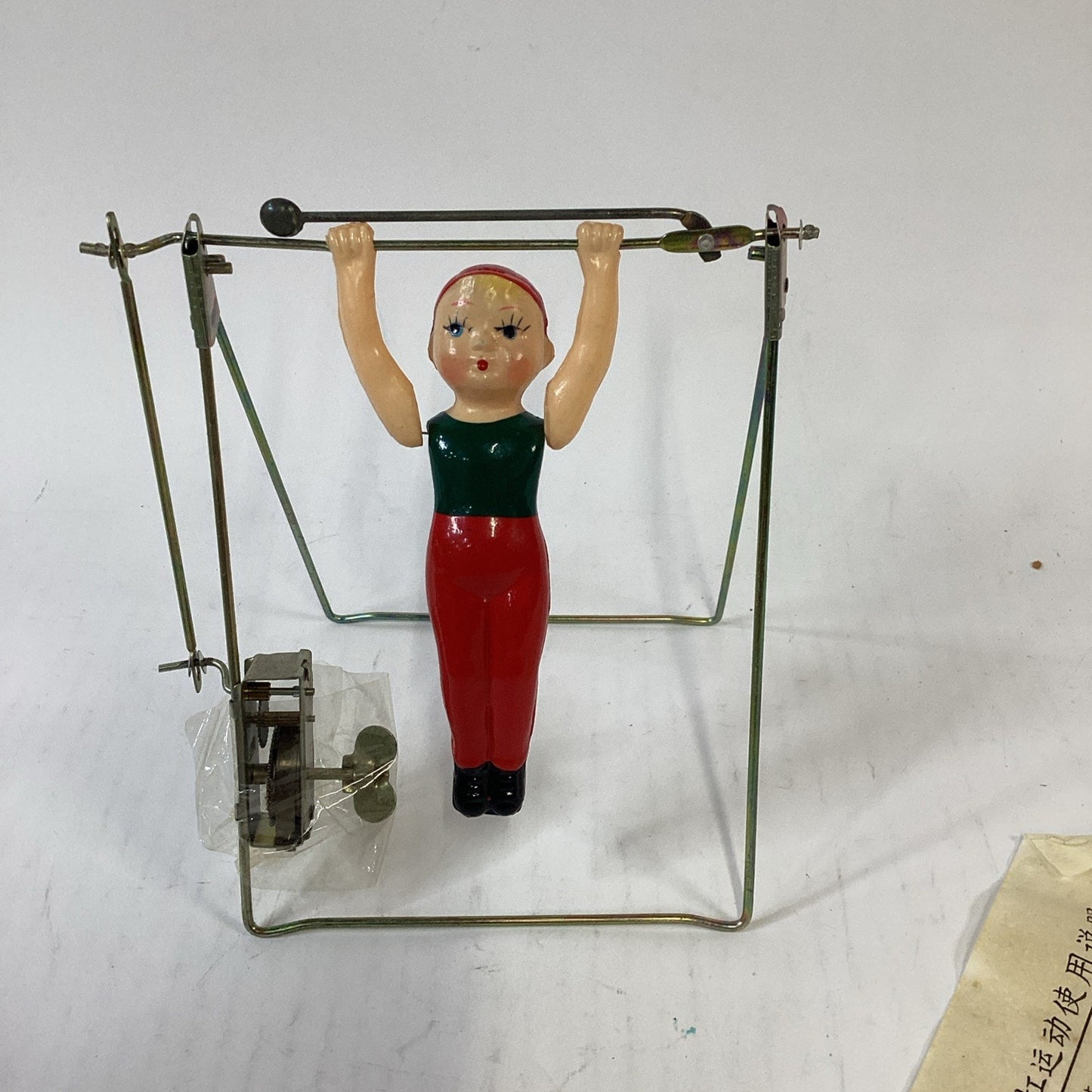 Vintage NOS Wind Up Trapeze Single Bar Exercise Toy China - Opened Box