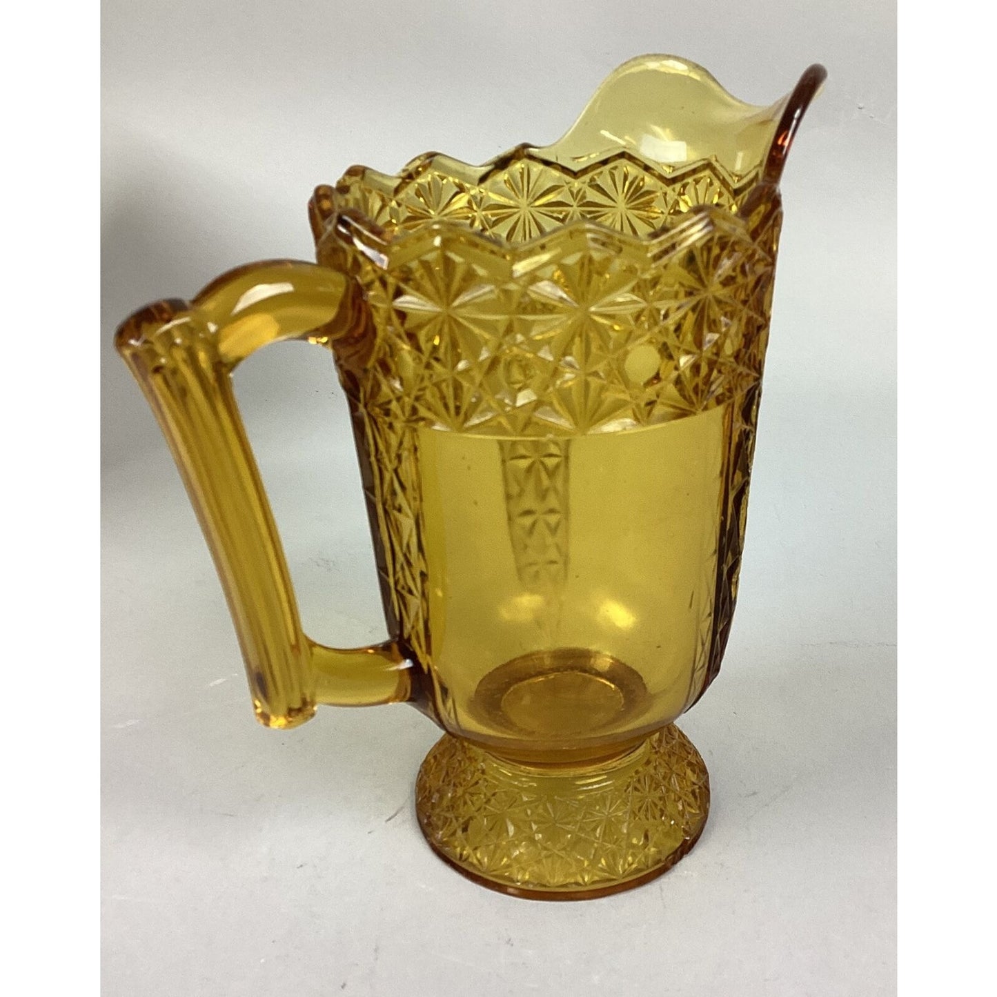 Vintage McKee Queen Daisy & Buttons Amber Glass Footed Pitcher - 8 1/4”