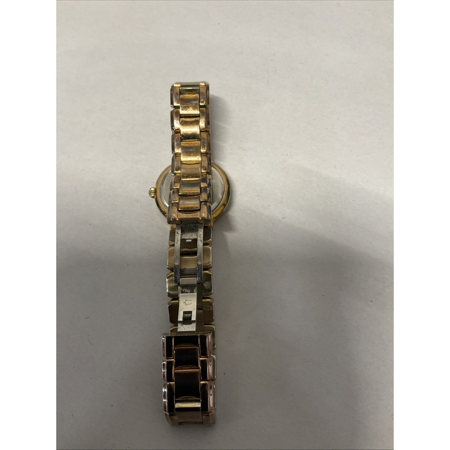 Bulova gold tone watch with silver face