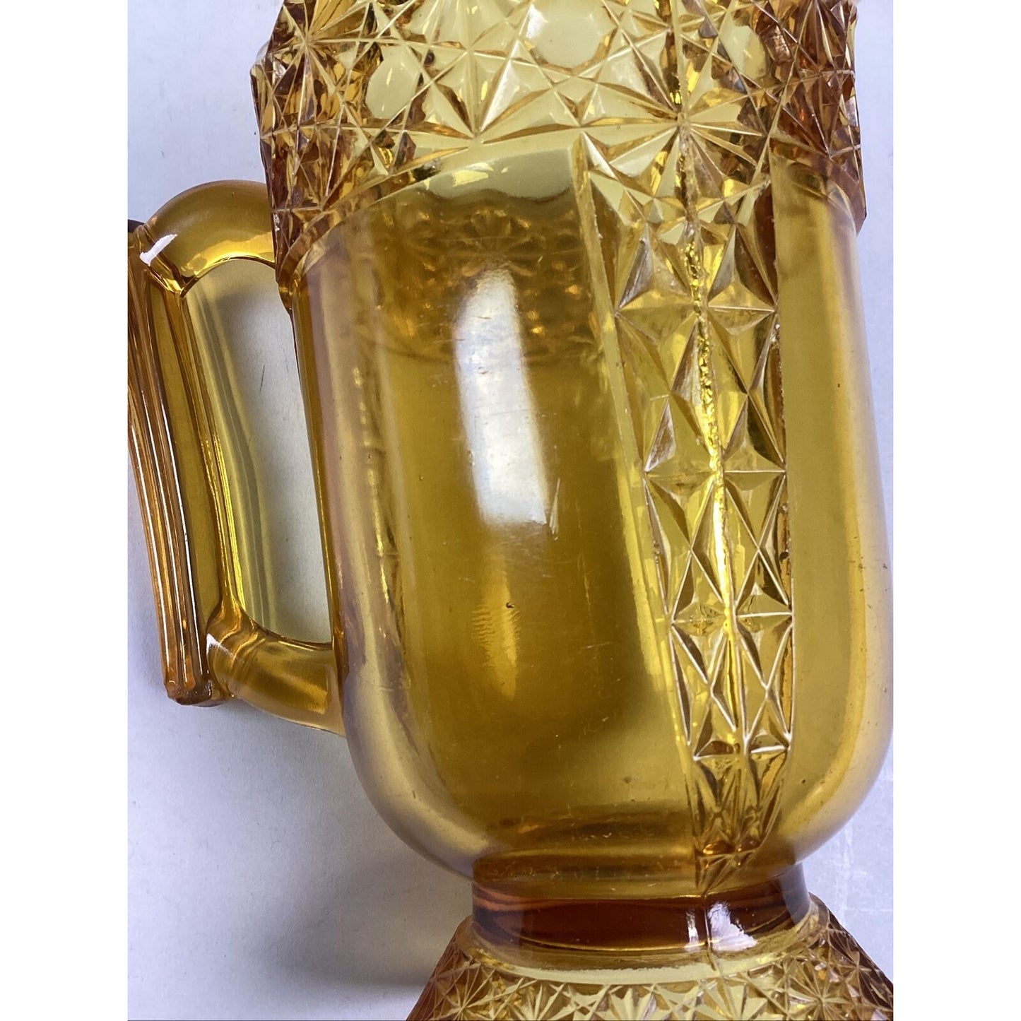 Vintage McKee Queen Daisy & Buttons Amber Glass Footed Pitcher - 8 1/4”