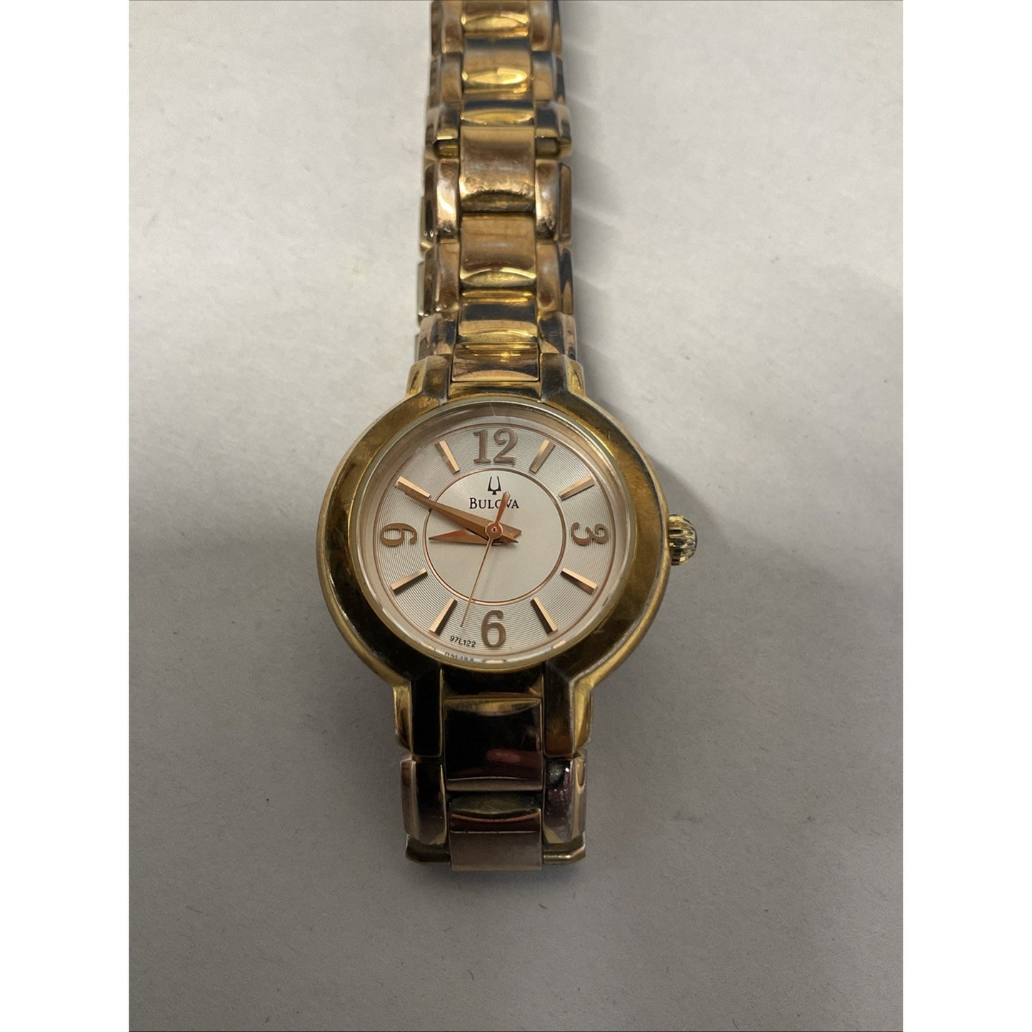 Bulova gold tone watch with silver face