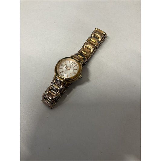 Bulova gold tone watch with silver face