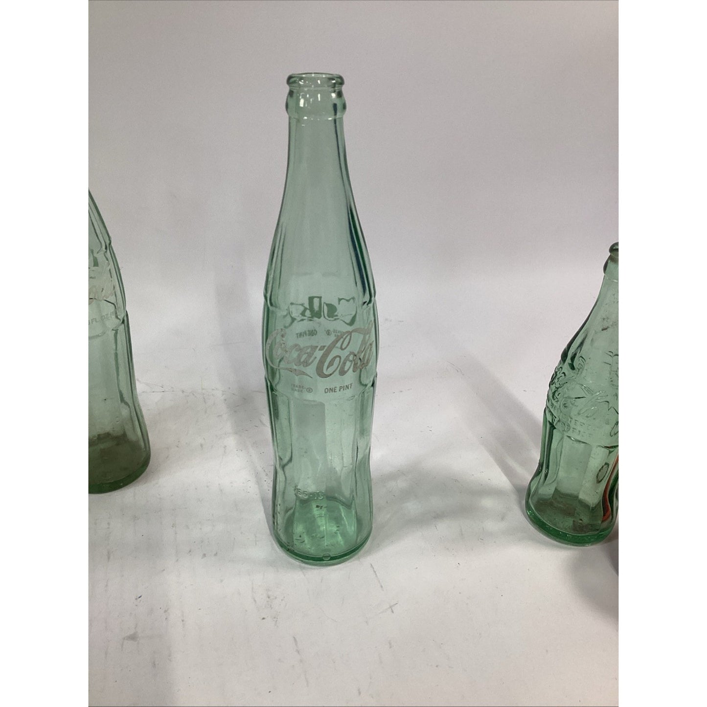 Lot of 7 Vintage Green Glass 16 Oz 1 Pint Coca Cola Bottles