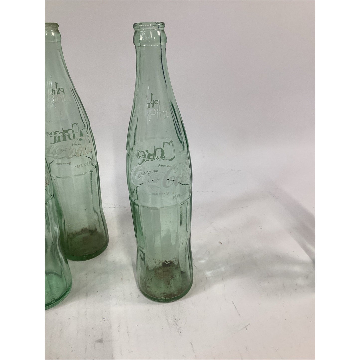 Lot of 7 Vintage Green Glass 16 Oz 1 Pint Coca Cola Bottles
