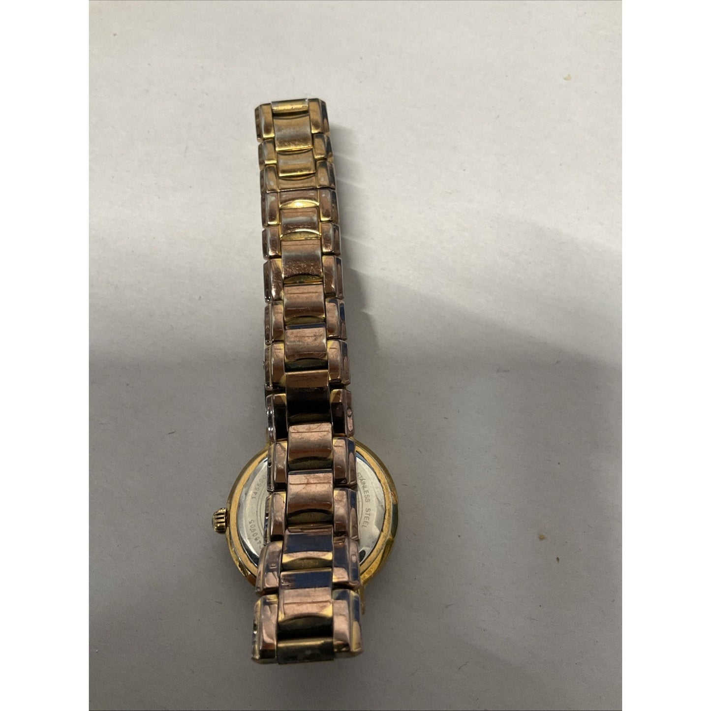 Bulova gold tone watch with silver face