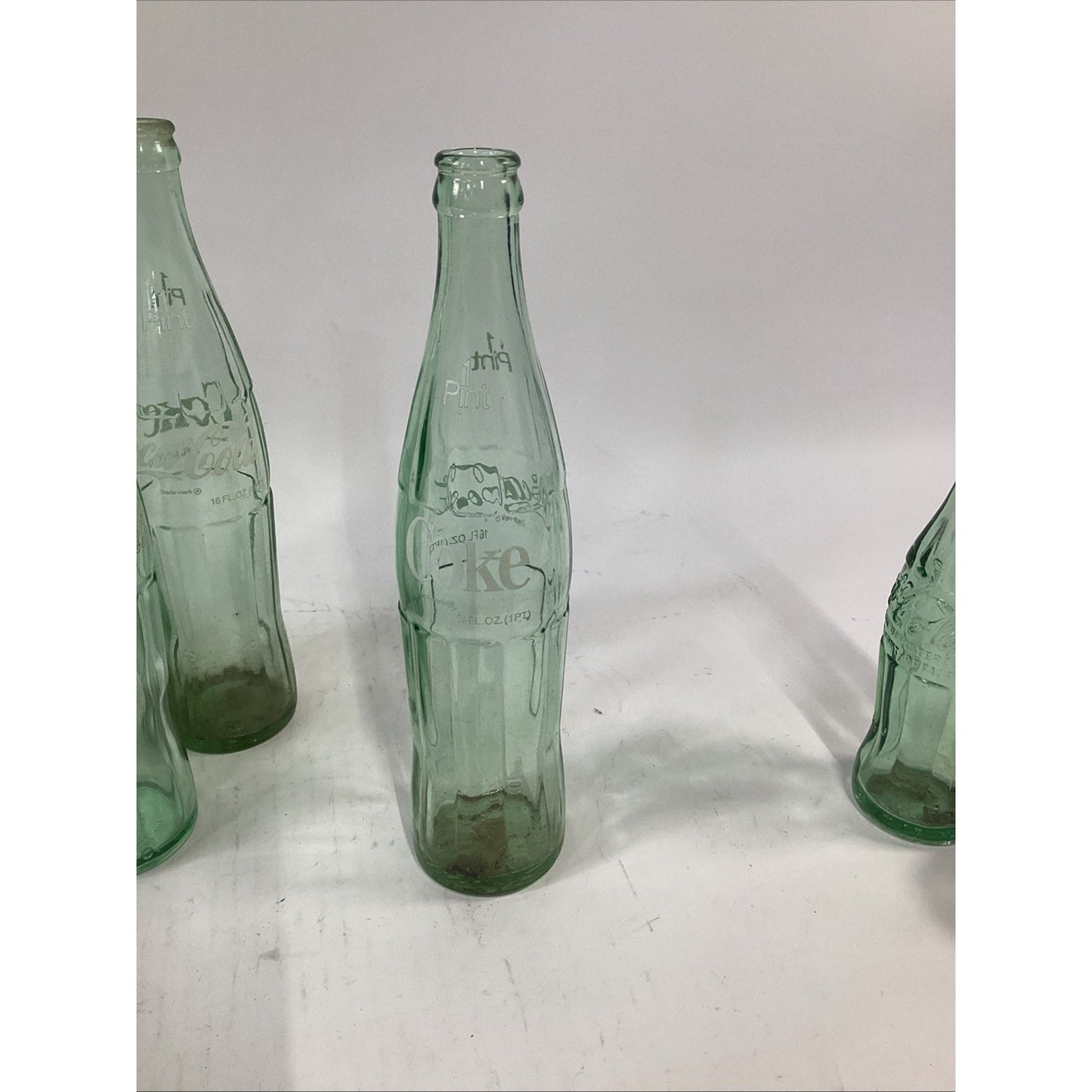 Lot of 7 Vintage Green Glass 16 Oz 1 Pint Coca Cola Bottles