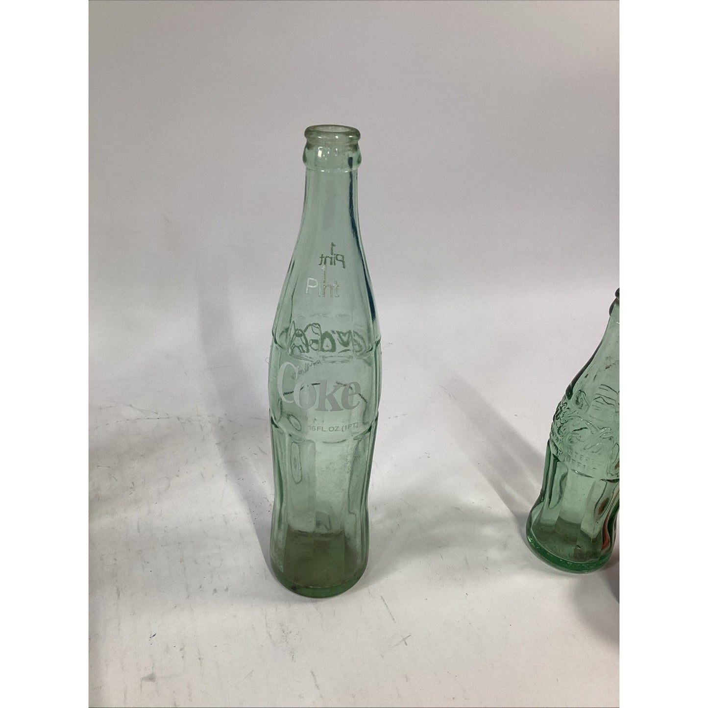 Lot of 7 Vintage Green Glass 16 Oz 1 Pint Coca Cola Bottles